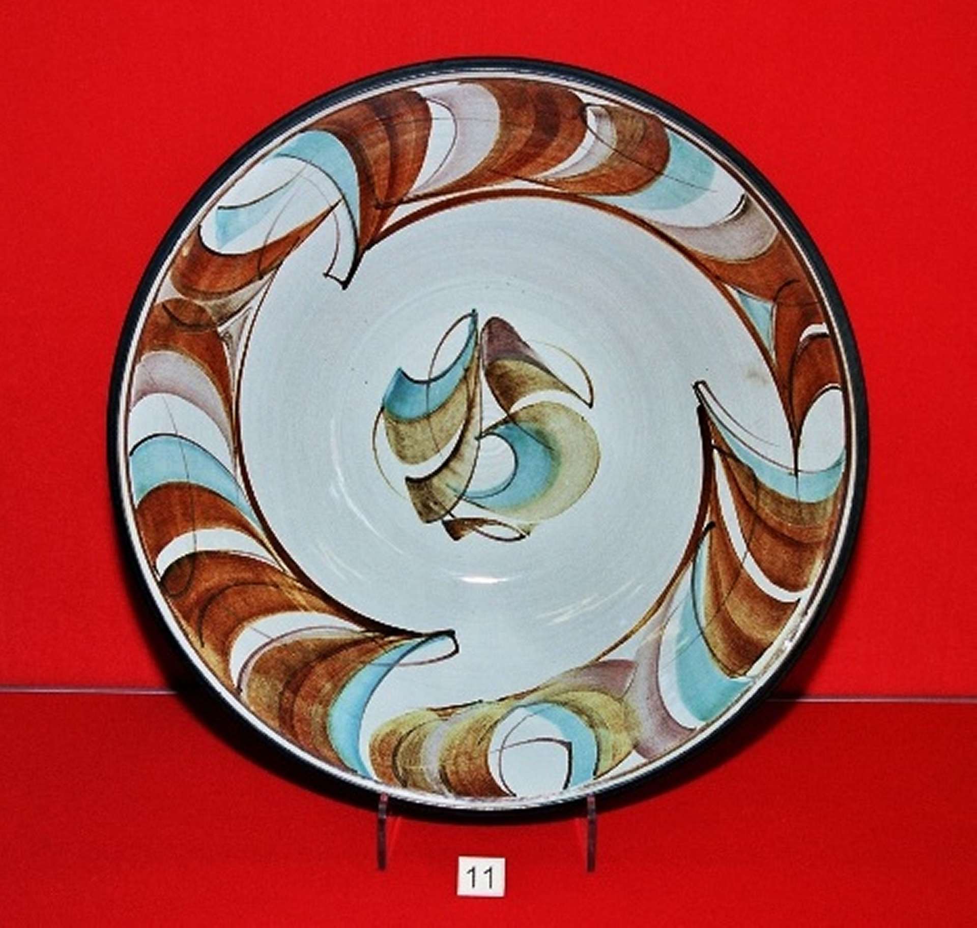 Image courtesy of West Berkshire Museum Tin glazed bowl, abstract blue swirls on grey, 1970