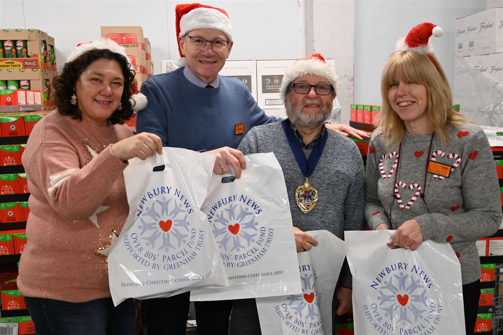 Jo Faulkner, Over 80's coordinator, with Andy Gray, Sainsbury's store manager, Carol Irvine, community champion and Newbury mayor Gary Norman