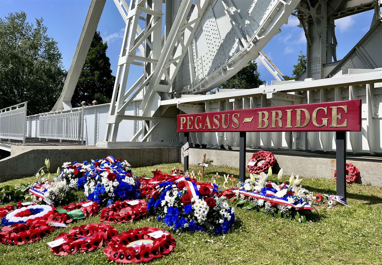 Tributes laid at the original Pegasus Bridge, removed in 1994. Credit: Mirek Gosney