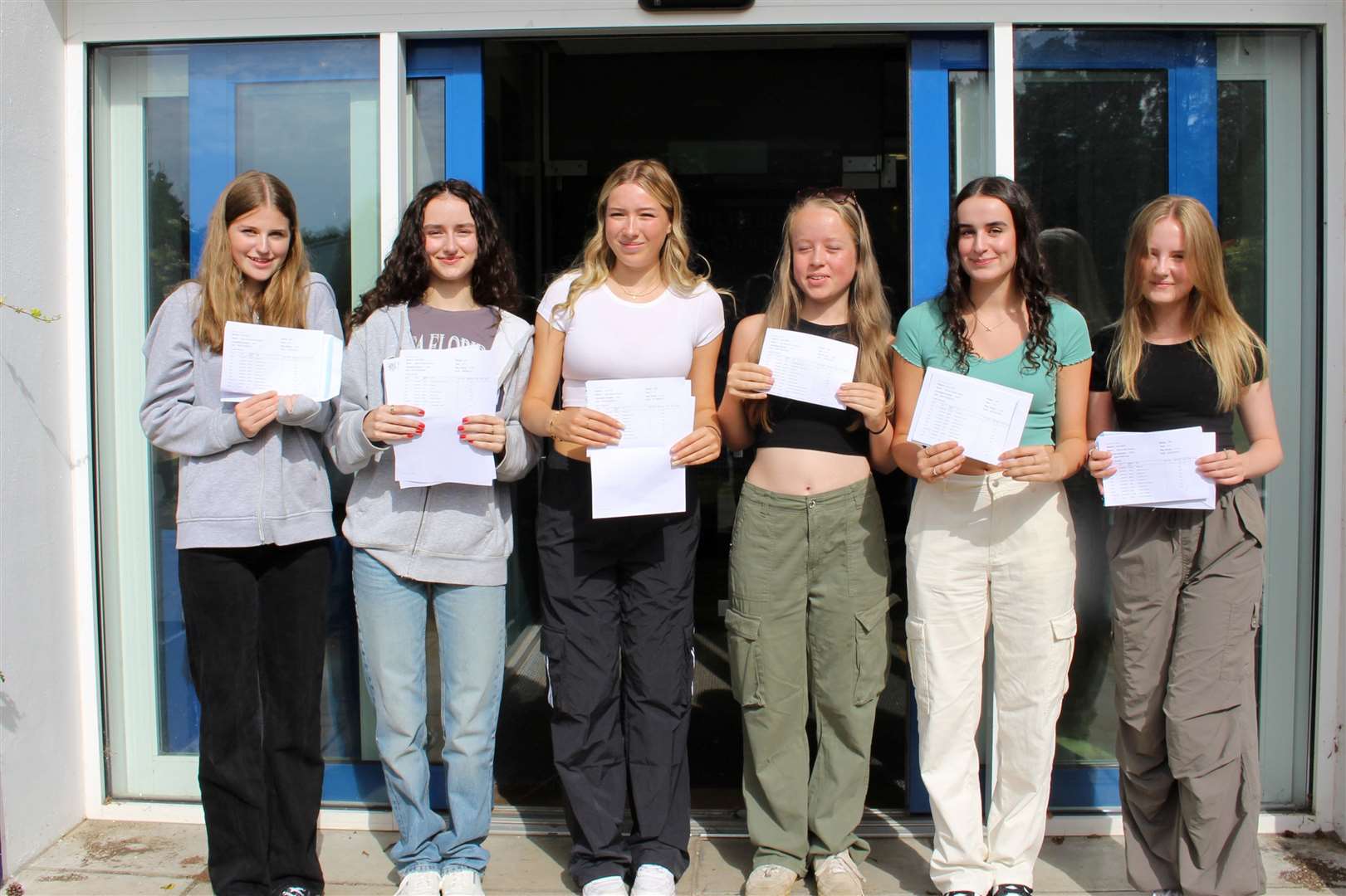 Brooke Ward (in the green t-shirt) with her friends after getting their results