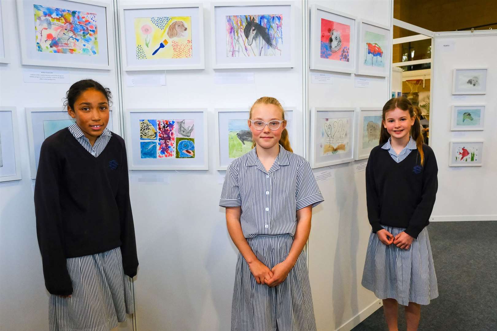 Children in front of their art