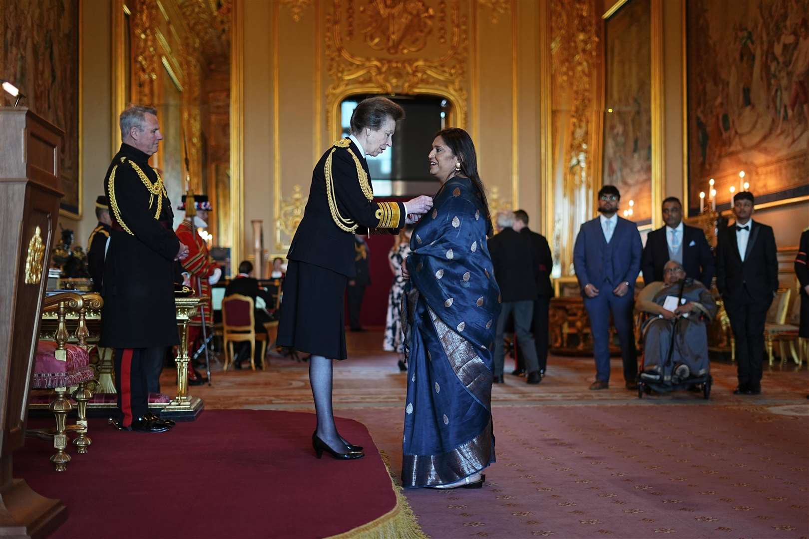 Seema Misra, from Bisley, Campaigner for Subpostmasters, is made an Officer of the Order of the British Empire by the Princess Royal (Aaron Chown/PA)