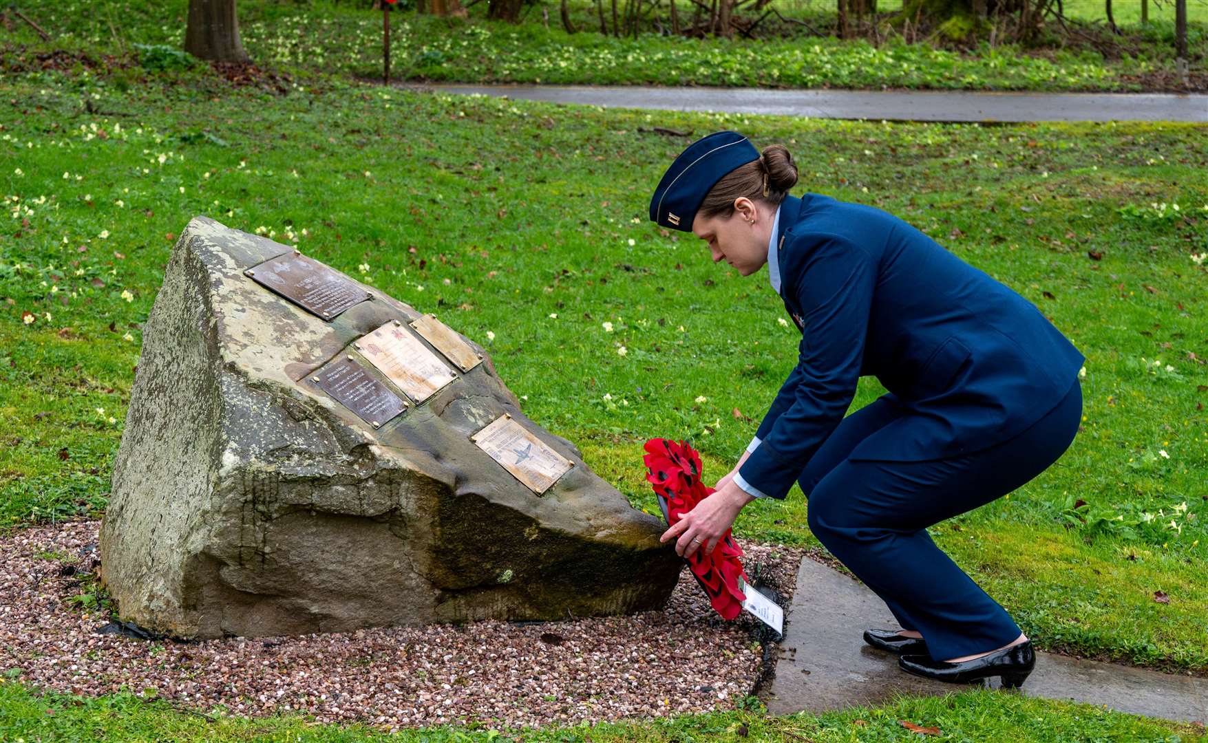 Some brave souls ventured down to the memorial grove to lay wreaths once the rain subsided. Credit: USAF Staff Sgt Jessica Avallone