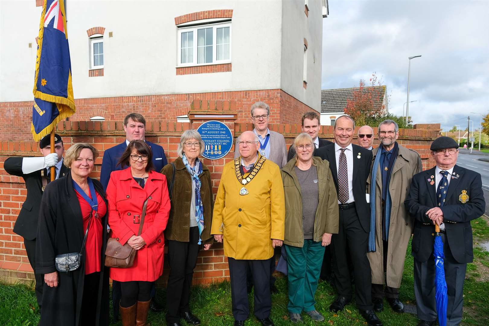 The granddaughter and great grandaughter of Urquhart with the mayor, deputy mayor and mayoress of Thatcham, members of the Thatcham Town Council heritage working party and Royal British Legion