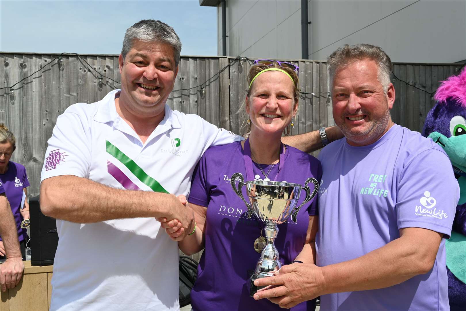Mark Norgate, MD at Donnington New Homes, 24-hour tennis match winner Roxy Cox and Trevor Goodall, CEO of New Life