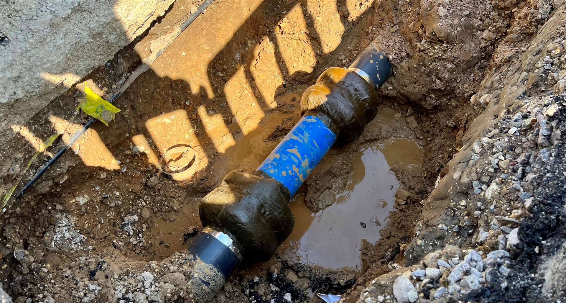 The leaking water pipe on the footpath by The Moors Playground