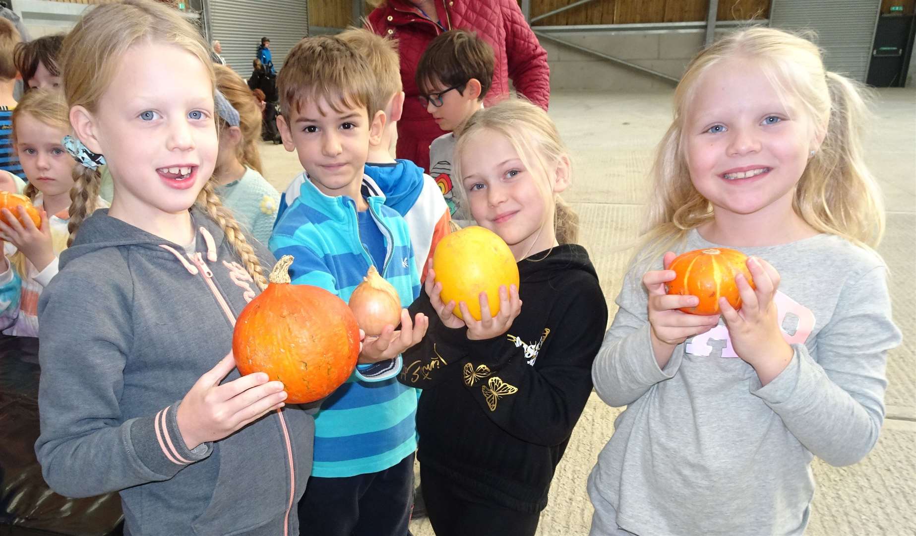 Newbury pupils holding their pumpkins