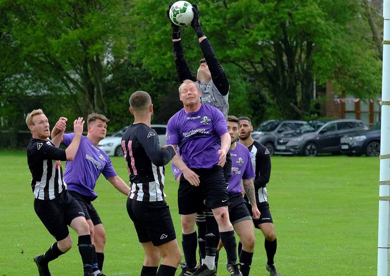 The Northworx keeper does well to collect a high cross