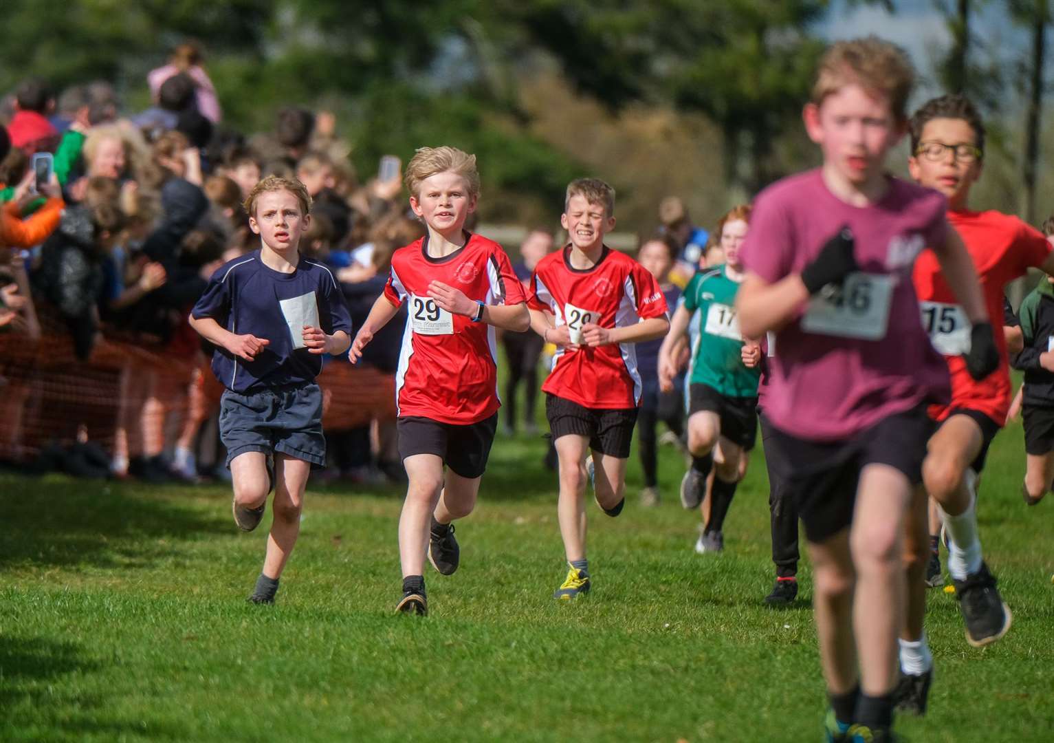 Year 3 and 4 boys approach the finish