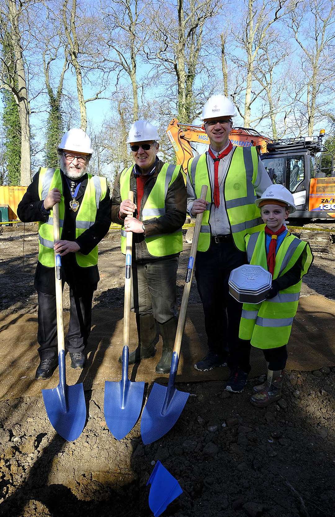 Beaver Toby Daniels, 7, burying a time capsule which includes a front page from the NWN, watched by deputy mayor Gary Norman, former chairman Eugene Futcher and group Scout leader Rob Daniels