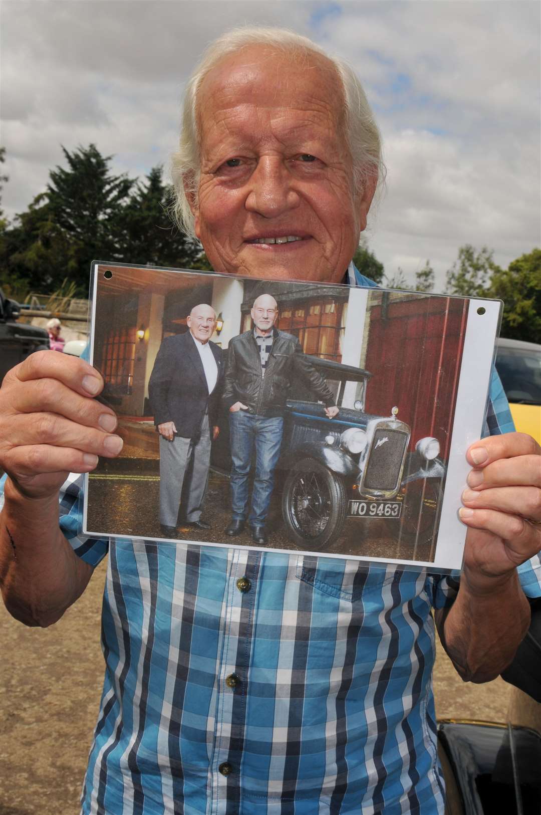 Philip Gent displayed a photo of Stirling Moss and the Star Trek actor Patrick Stewart, who had both driven his 1938 Austin 7 Opel Tourer, picture Geoff Fletcher