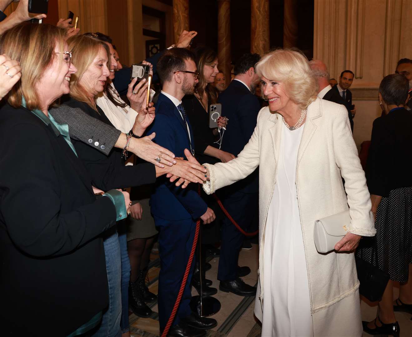 Camilla rewore her wedding dress during a visit to the Italian Parliament. The white Anna Valentine dress has been repurposed with added embroidery (Ian Vogler/Daily Mail/PA)