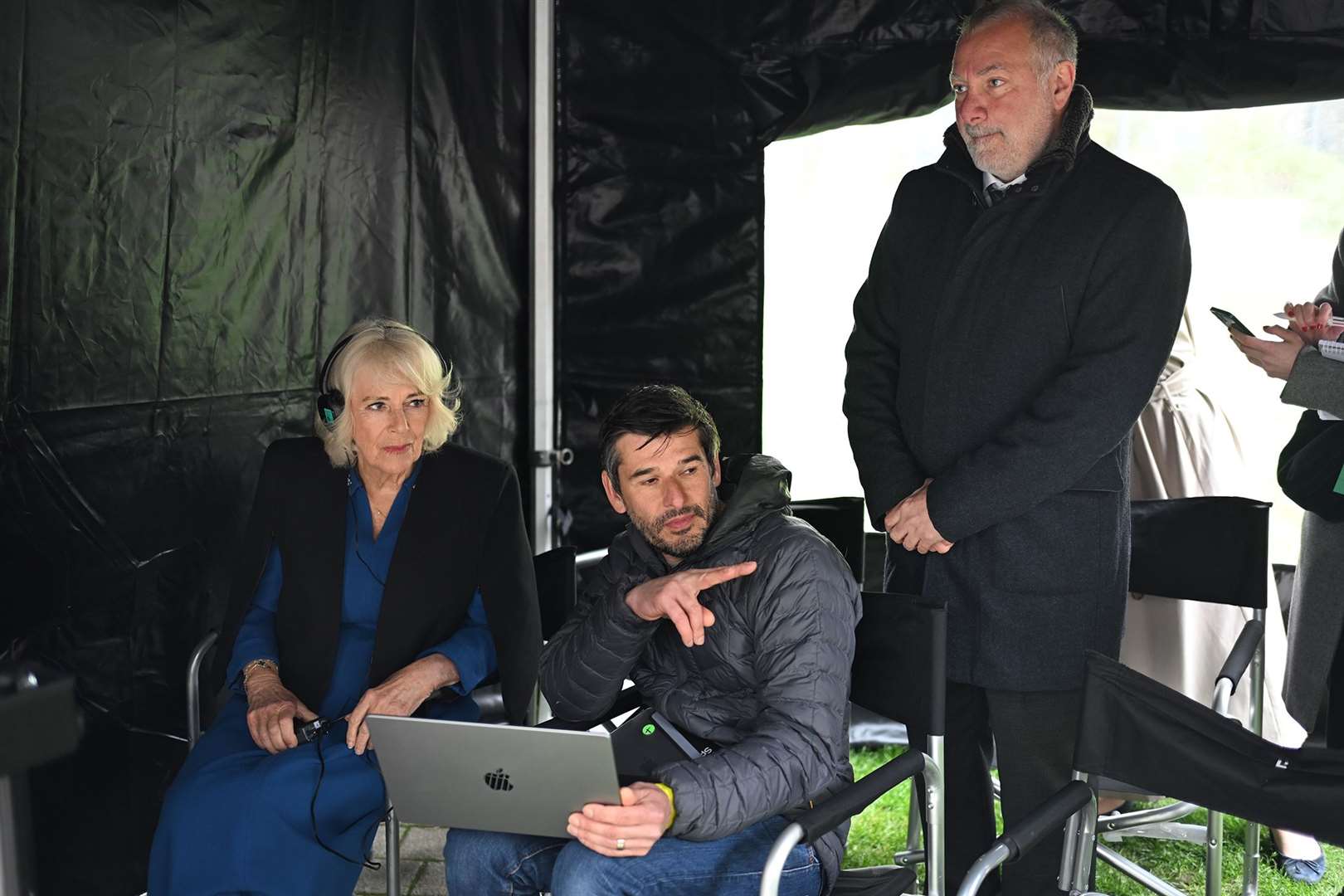 The Queen with VFX supervisor Mark Robinson and executive producer Jed Mercurio (right) during a visit to the set of Trigger Point (Eddie Mulholland/Daily Telegraph/PA)