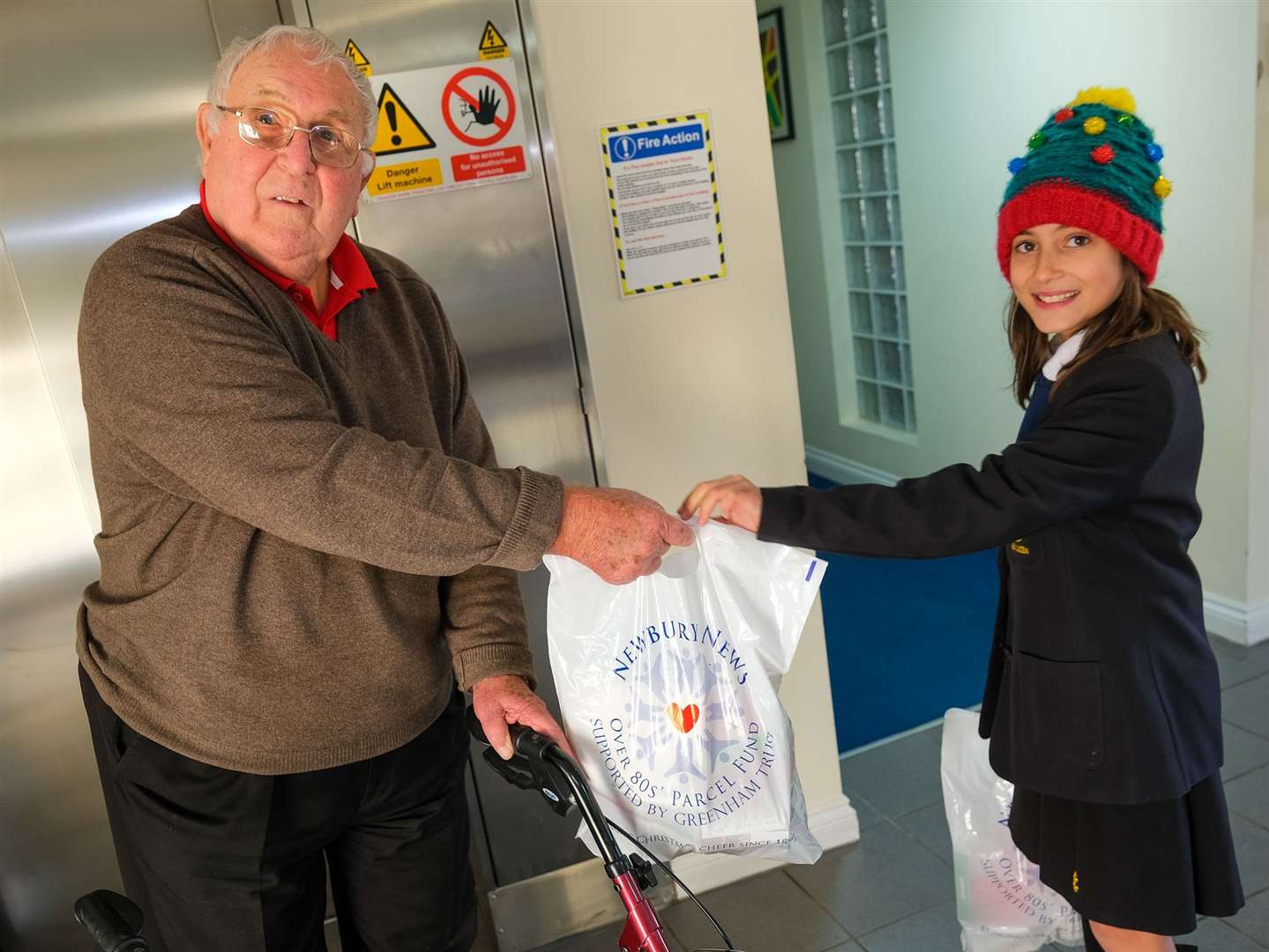 St Bart's pupils delivering parcels at Willow Close to James Priddy, aged 83