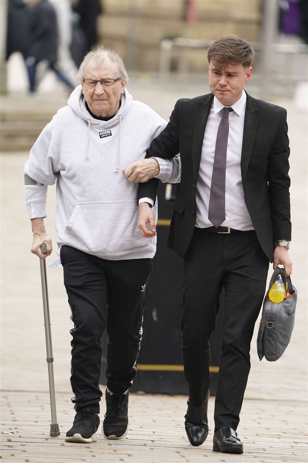 Kenneth Lingard, left, the grandfather of former Manchester United footballer Jesse Lingard, arrives at Liverpool Crown Court (Danny Lawson/PA)