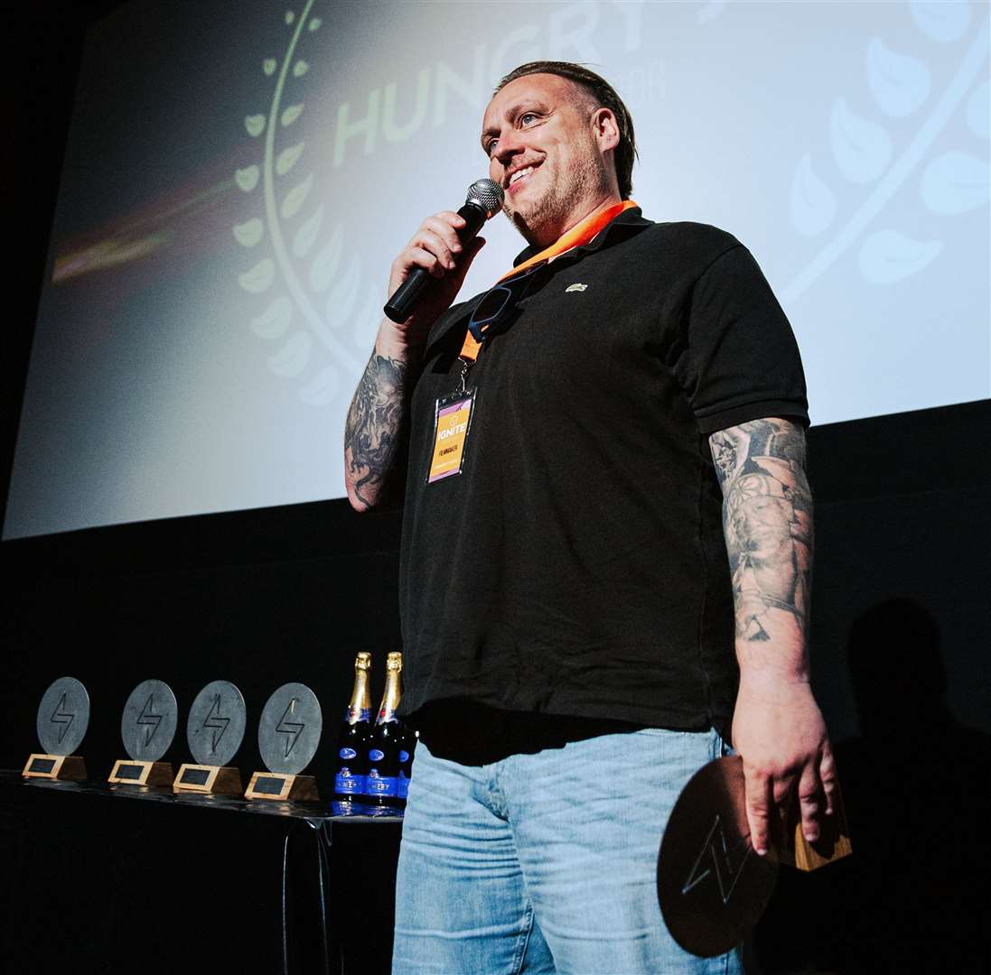 Bristolian filmmaker Paul Holbrook picking up his film’s Best Screenplay award. Credit: Ignite Film Festival