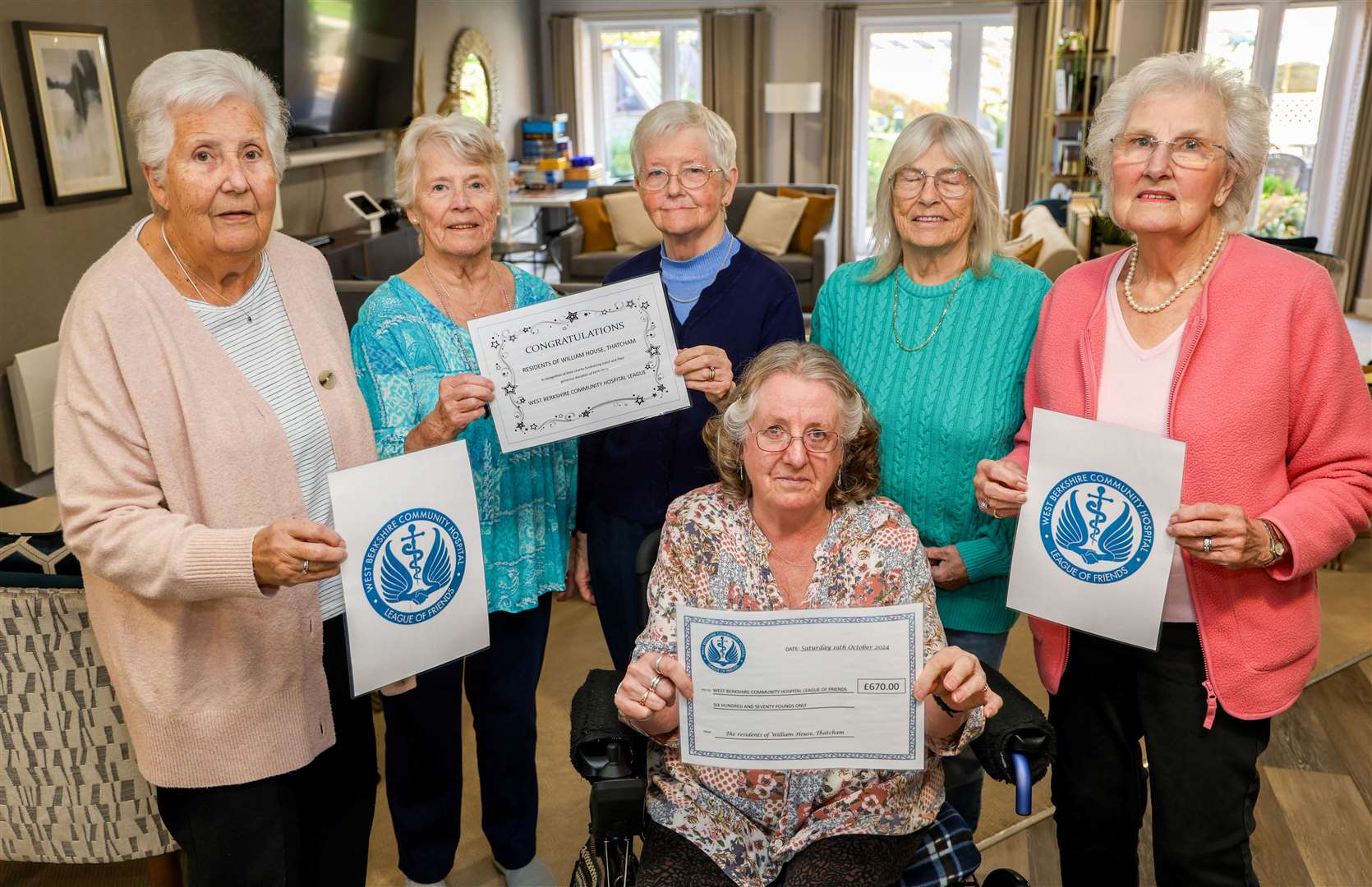 Margaret, Barbara, Sylvia, Sandra, Cordelia and Jennie, front, with cheque for West Berkshire Community Hospital League of Friends
