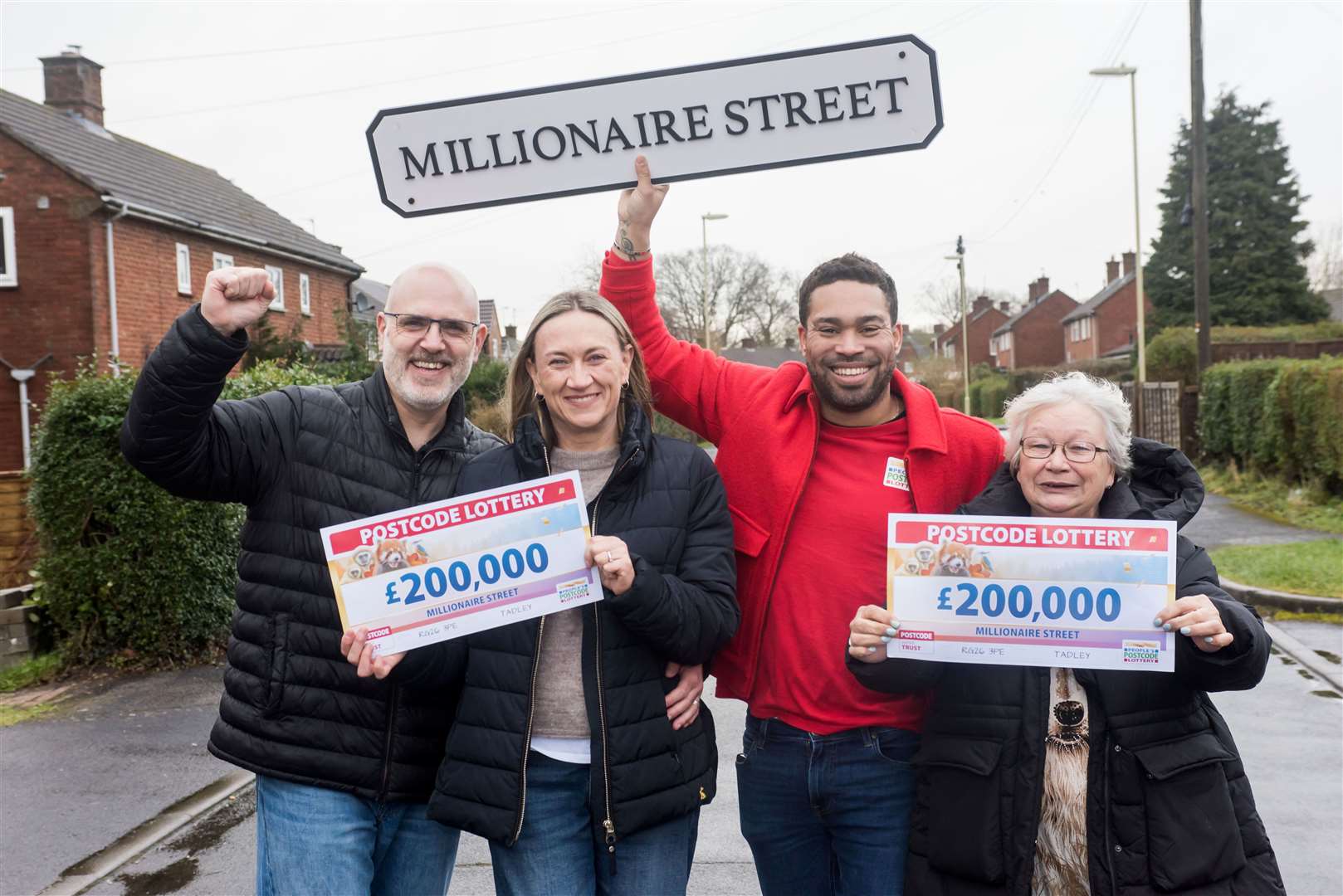 RG26 3PE residents celebrating their win with People's Postcode Lottery ambassador Danyl Johnson
