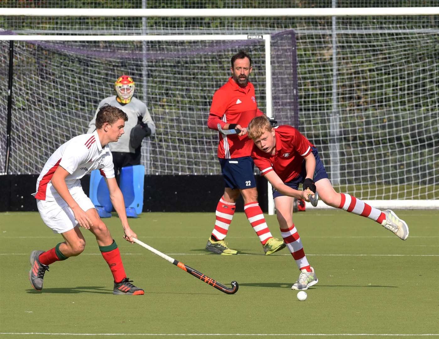The Newbury defence clear the ball