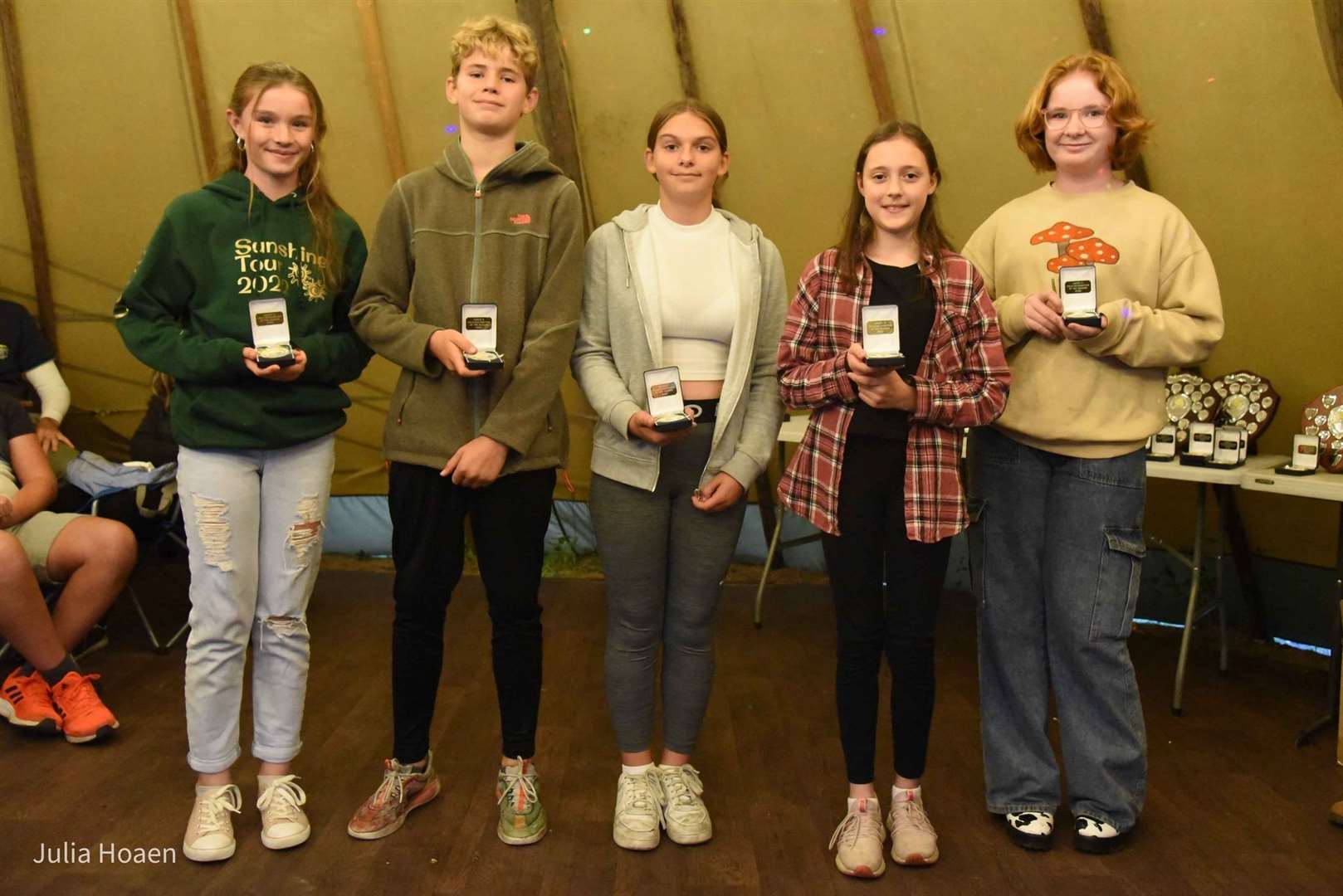 Eliska Simpson, Harry Fenner, Amber Stiles, Ella Cronk and Zoe Dickson collect their under-13 field athlete recognition awards