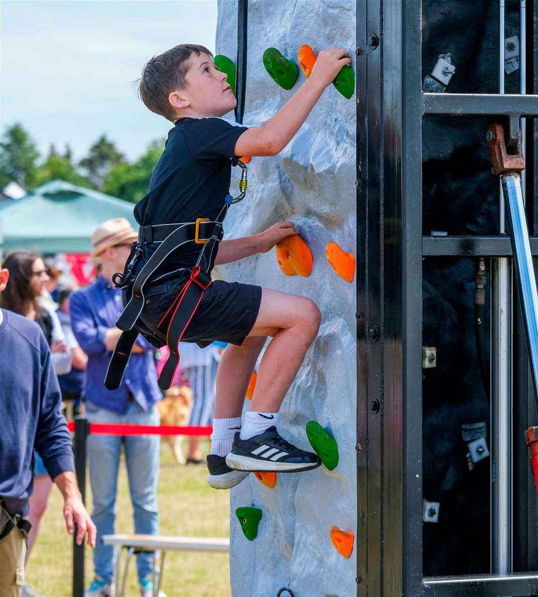 Max Barker, age nine, scaling the climbing wall