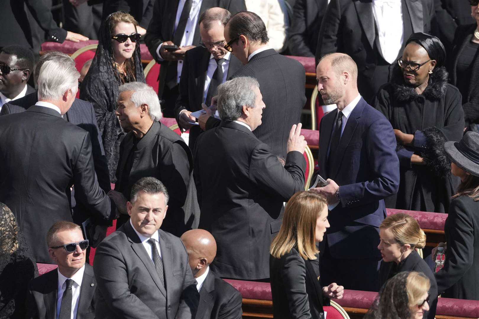 The Prince of Wales, centre right, speaking with guests before the service (AP Photo/Markus Schreiber)