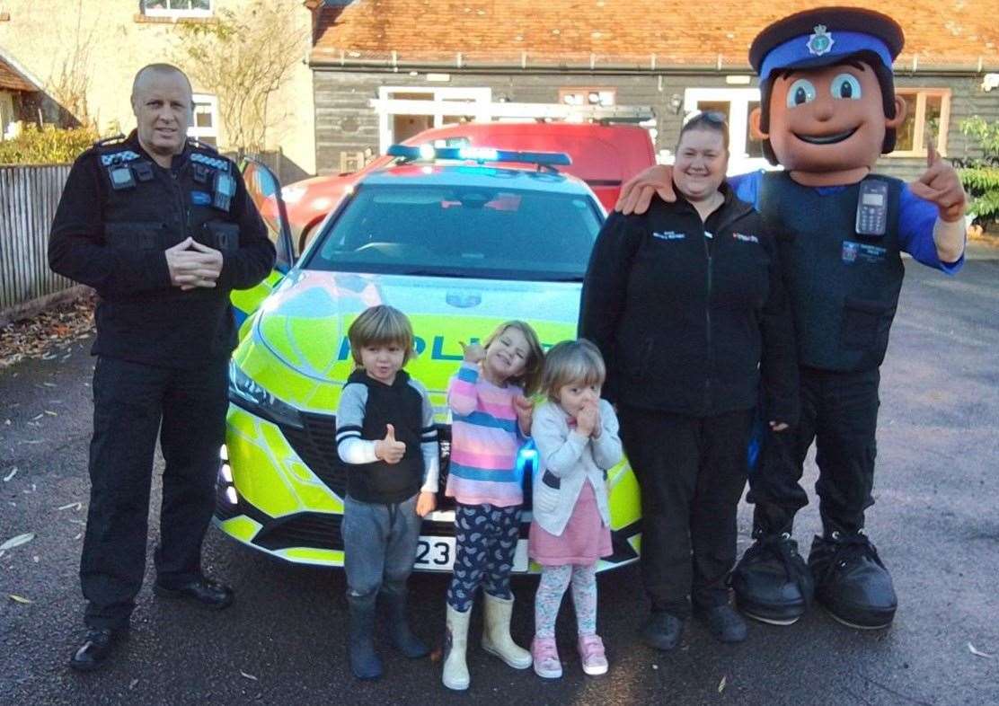 PCSO Alex and PCSO mascot John with Cedars Boot Farm staff and pupils