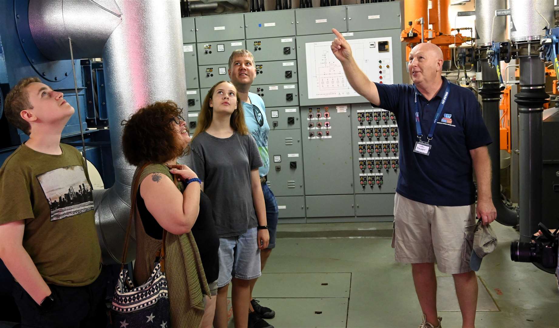 Volunteer guide, Stewart Dempster, show visitors inside the suite