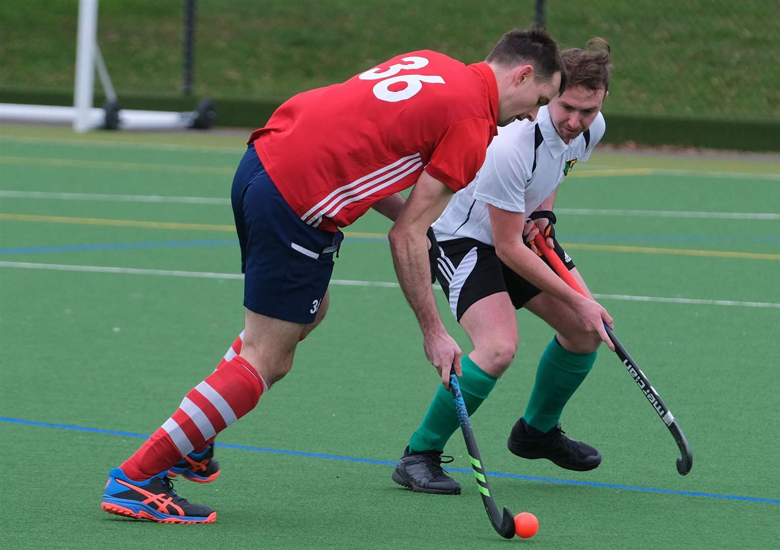 Two players have eyes on the ball