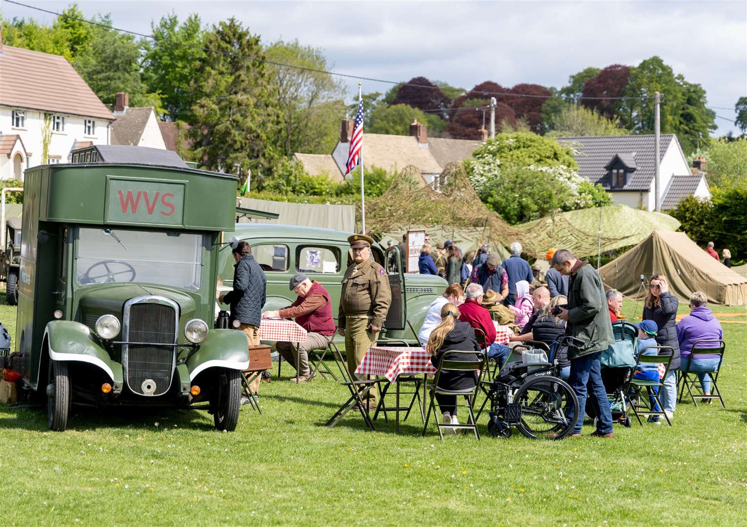 Crowds gather on the football field for VE Day commemorations