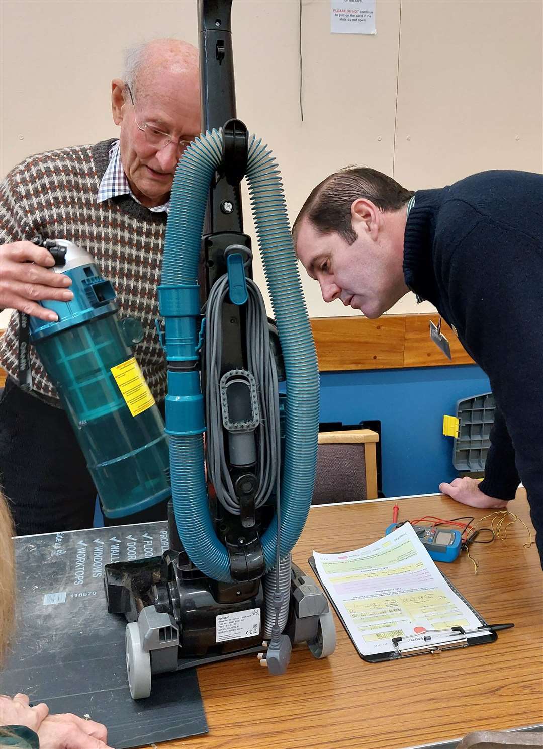 Newbury MP Lee Dillon investigating a faulty vacuum cleaner