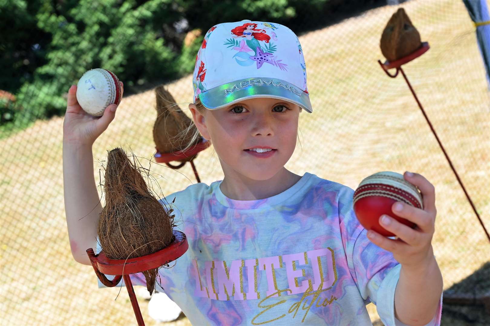 Isabel White (7) trying her hand on the coconut shy