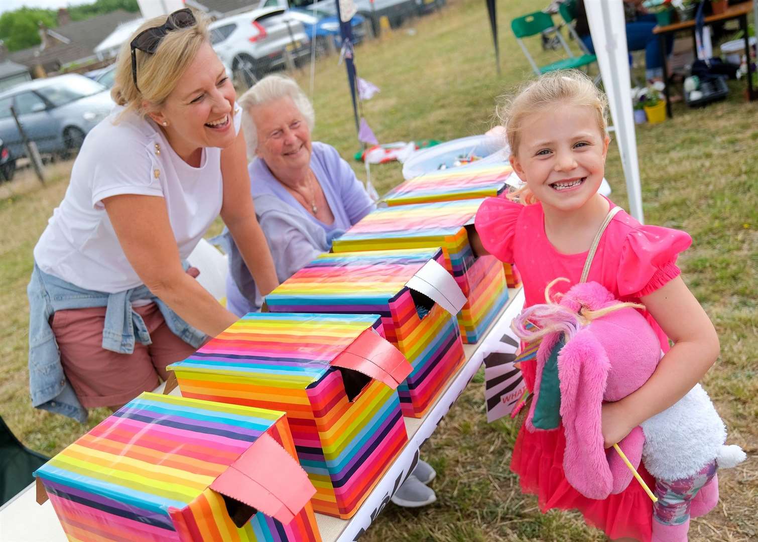 Andrea Vardy, Ottie Fielding, age five, and Kay Vardy play ‘Guess What’s in The Box’