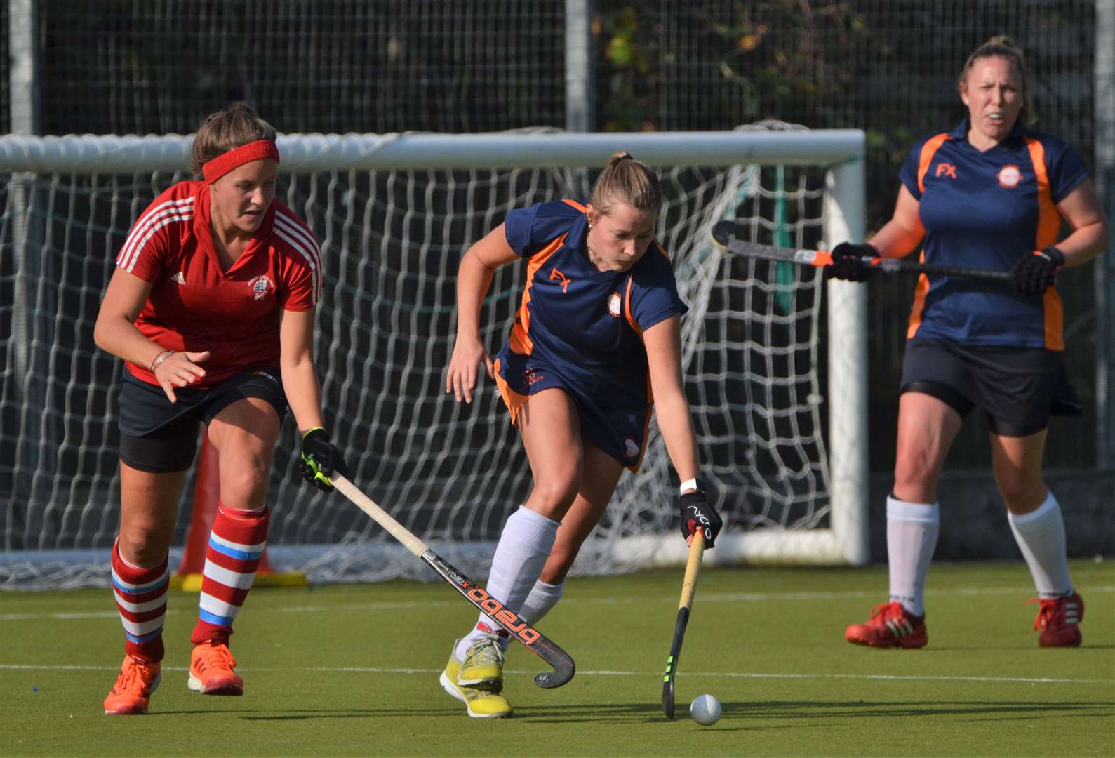 A Newbury player tries to win the ball back
