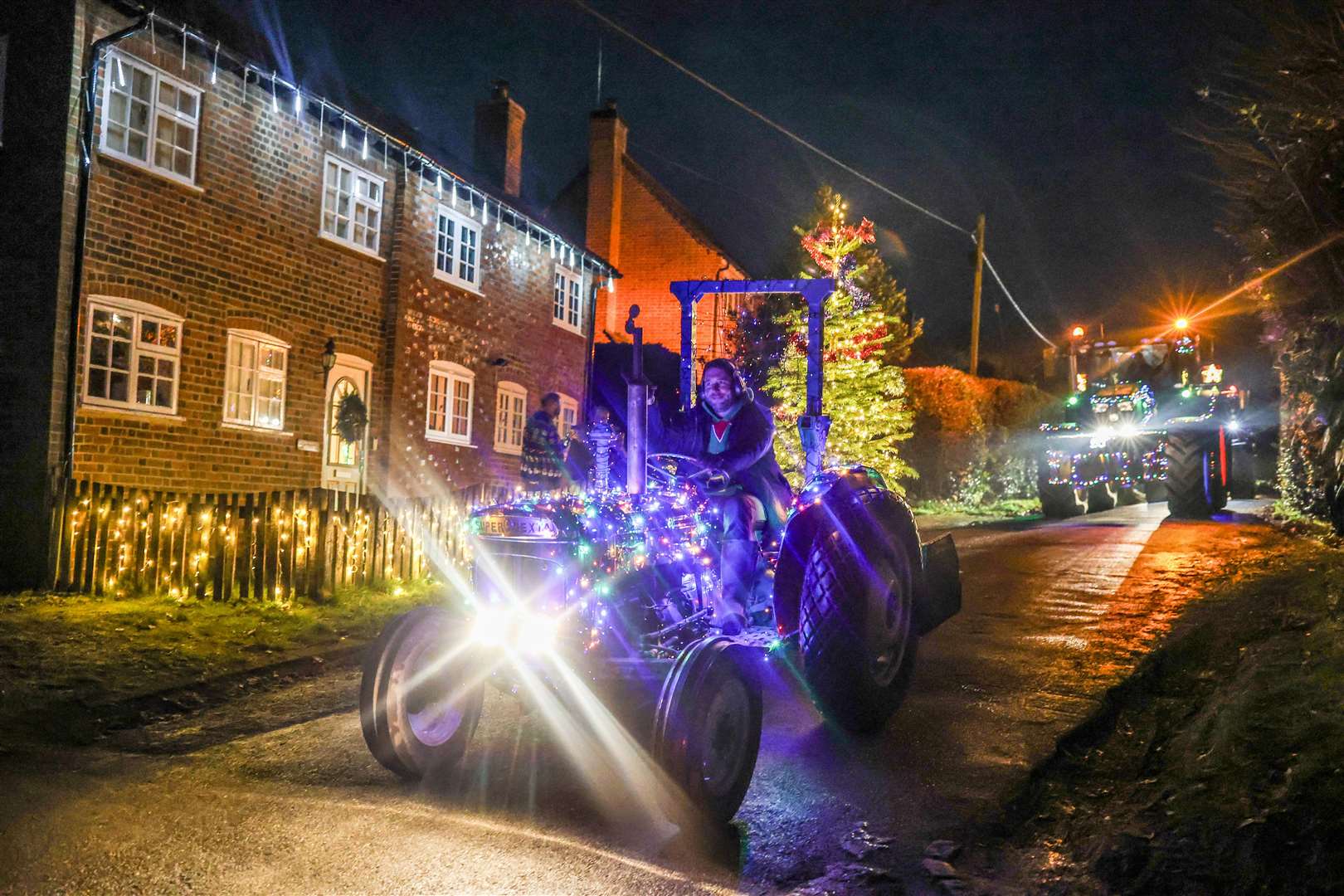 Woolton Hill Christmas Tractor Run coming along Tubbs Lane in Highclere