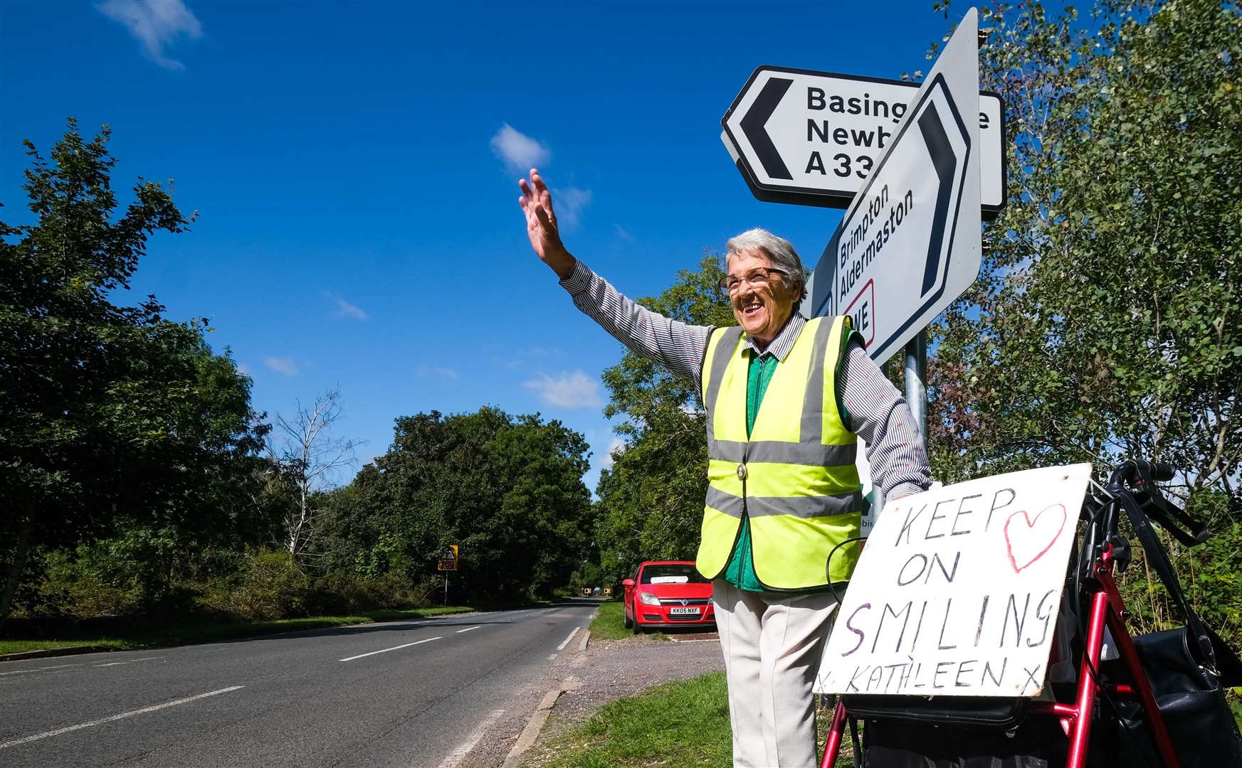Kathleen Watson waving to drivers