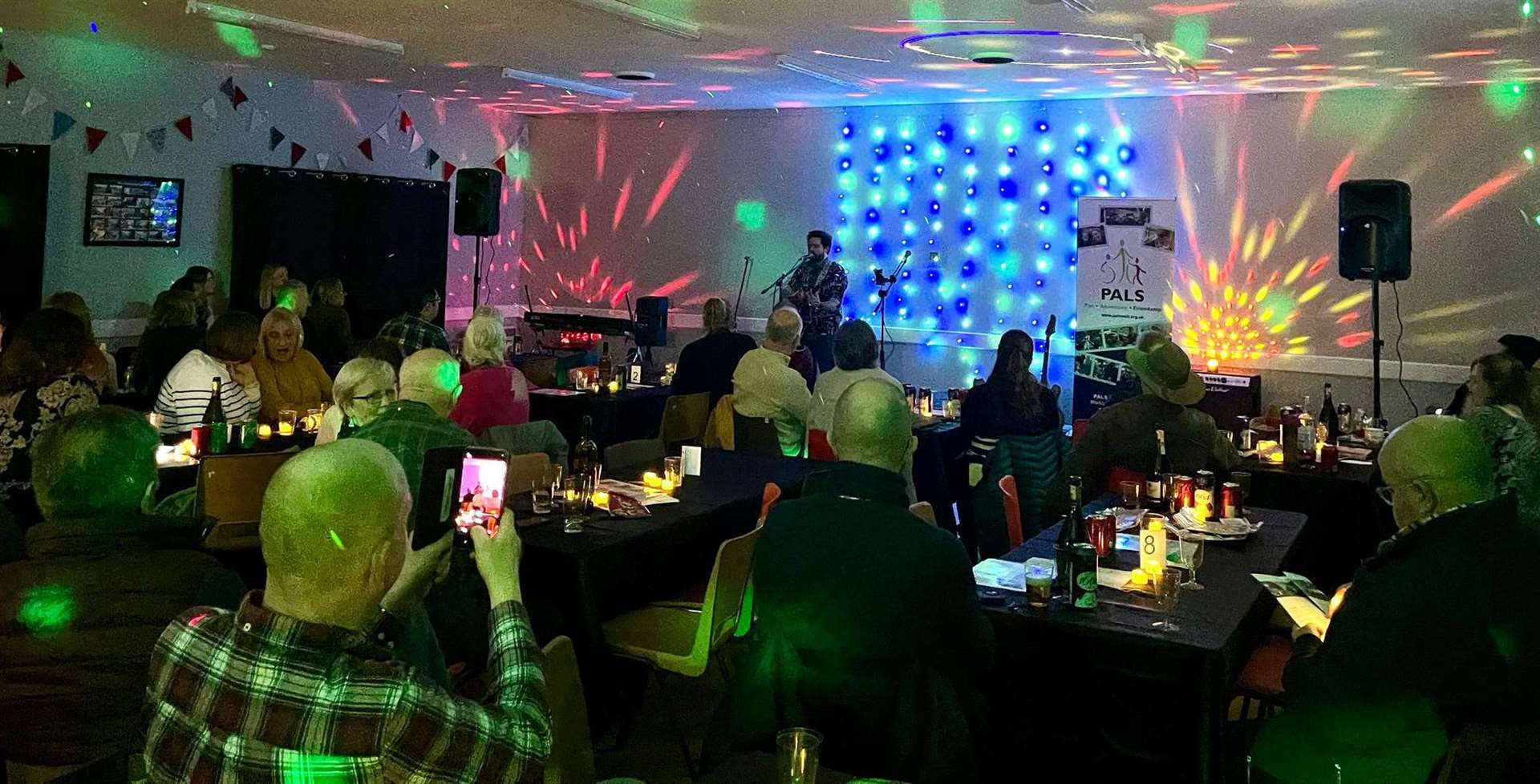 Group tables drinking and enjoying the range of music on offer