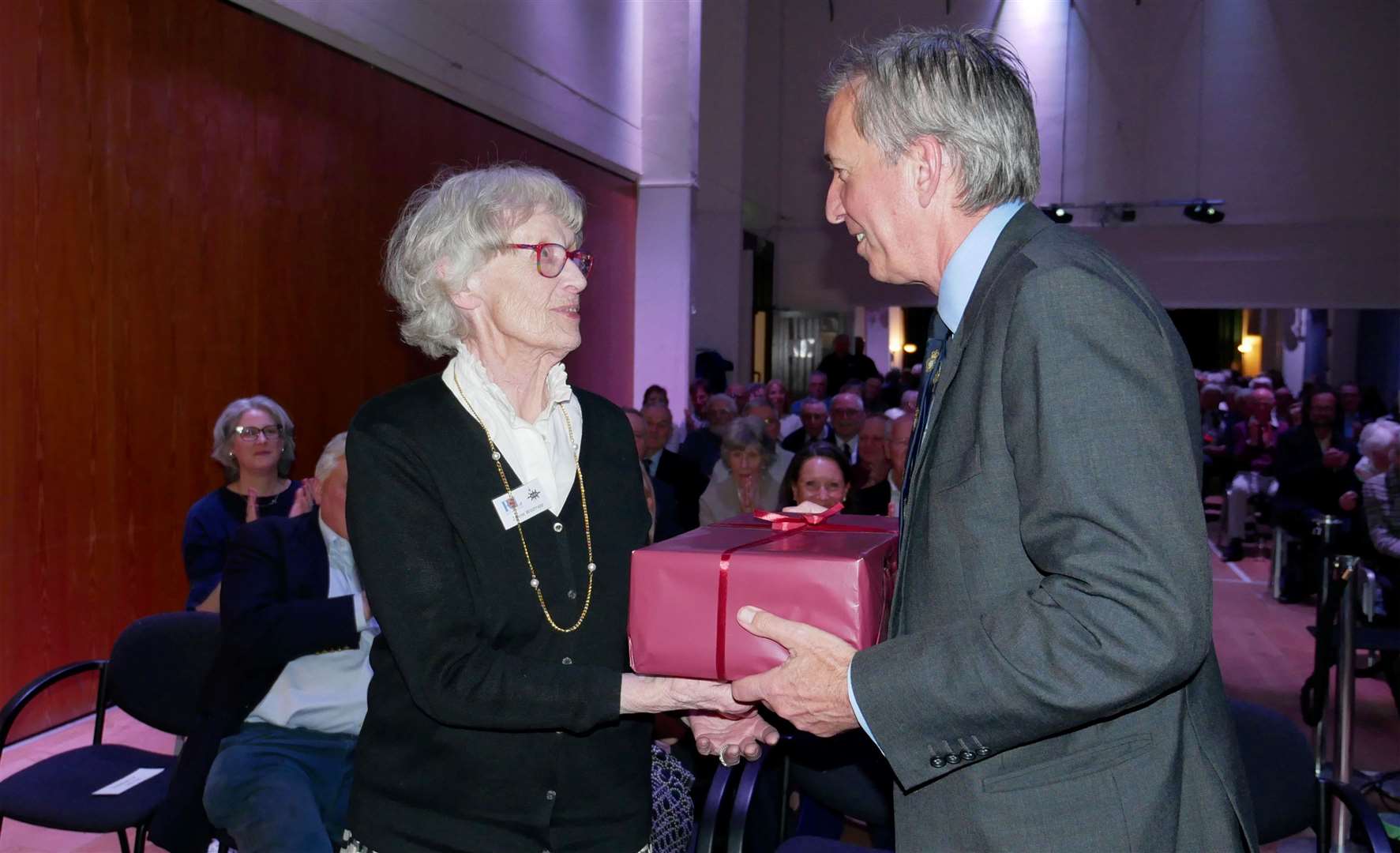 Janine Westropp presented James Bashall with a gift after his talk at the Fieldgate Centre. Image supplied by Gareth Martin