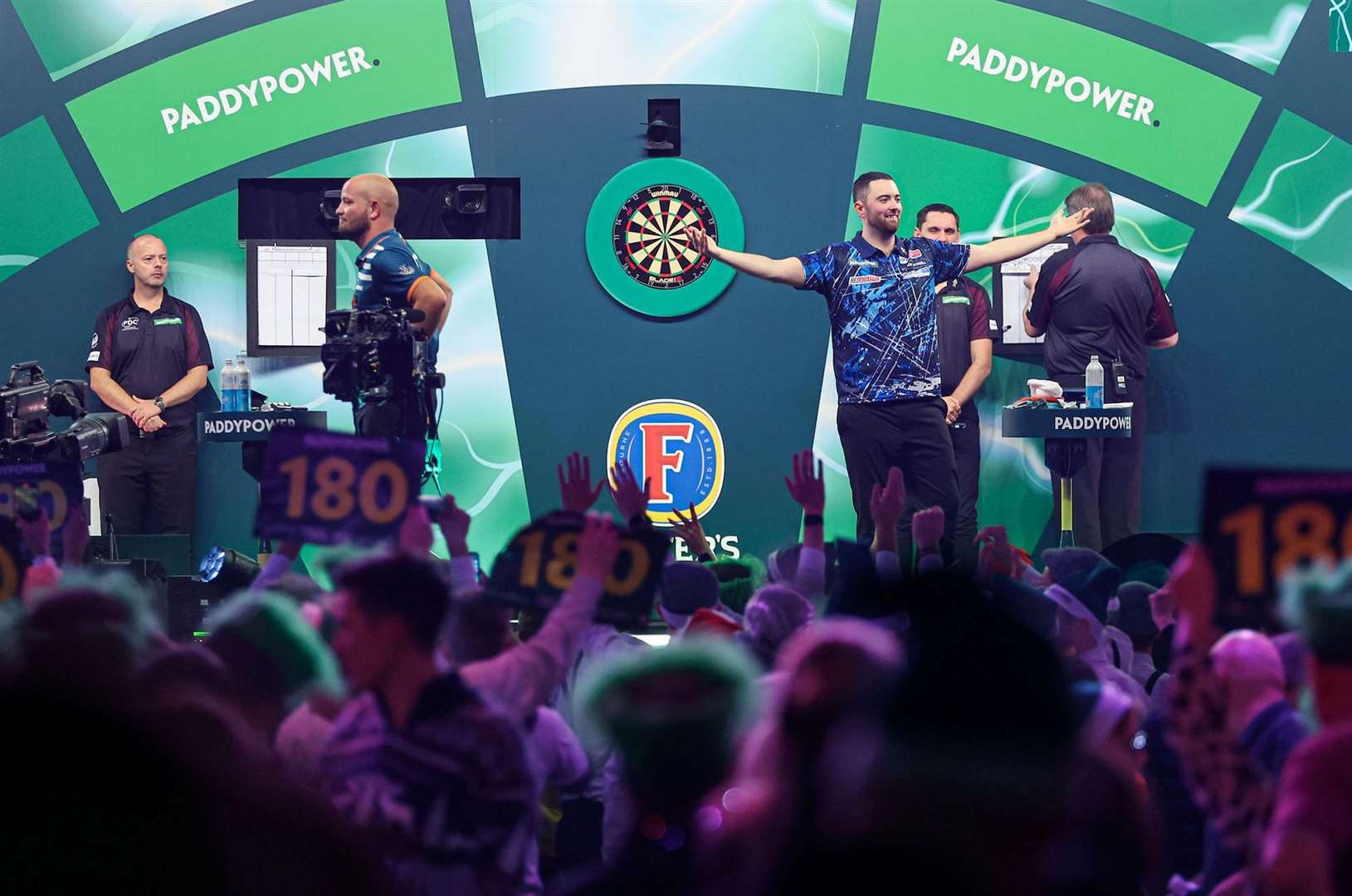 Luke Humphries opened his World Championship title defence with a routine win - Photo: PDC