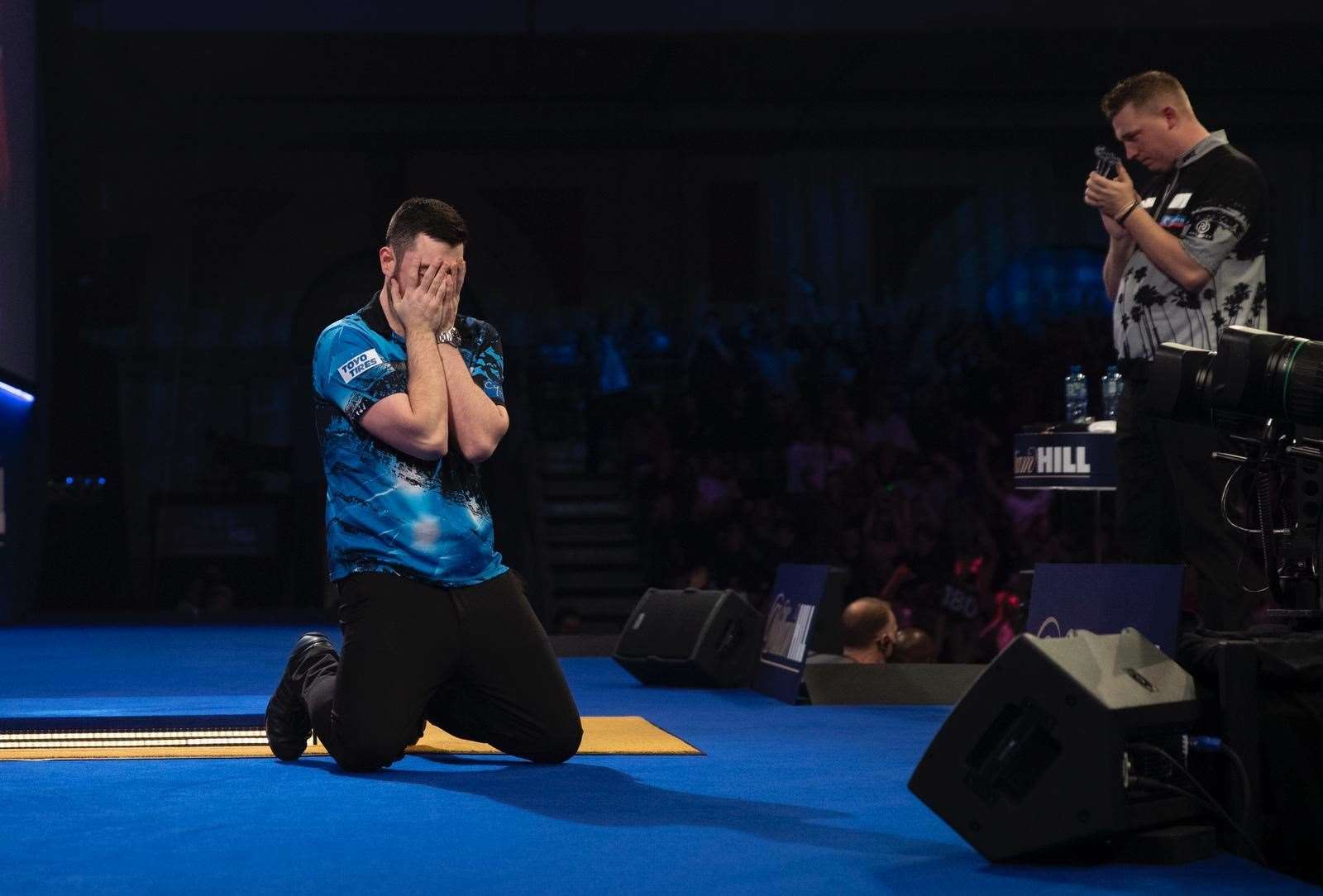 Luke Humphries holds his head in his hands after his win Pic: Lawrence Lustig/PDC