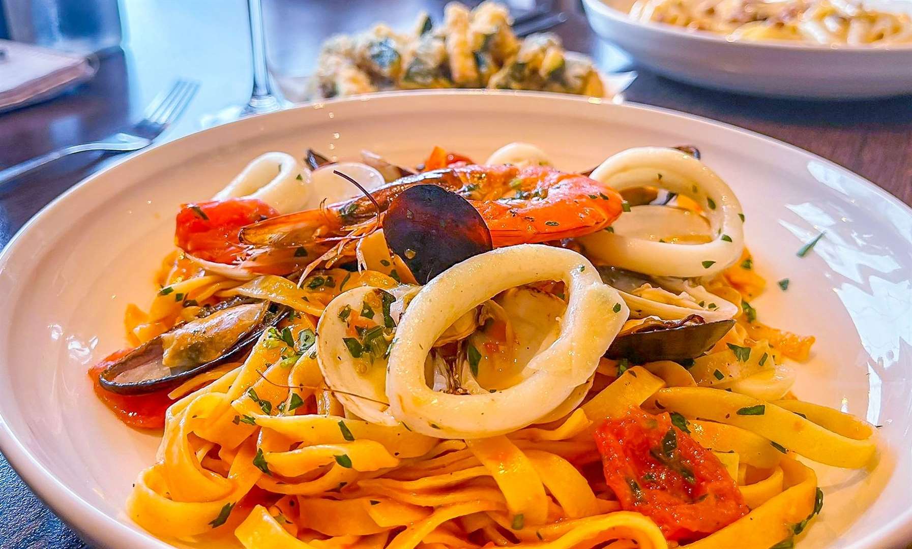 Tagliatelle Nino (£18.20), egg noodles with clams, mussels, king prawns, squid, cherry tomatoes and a touch of tomato sauce