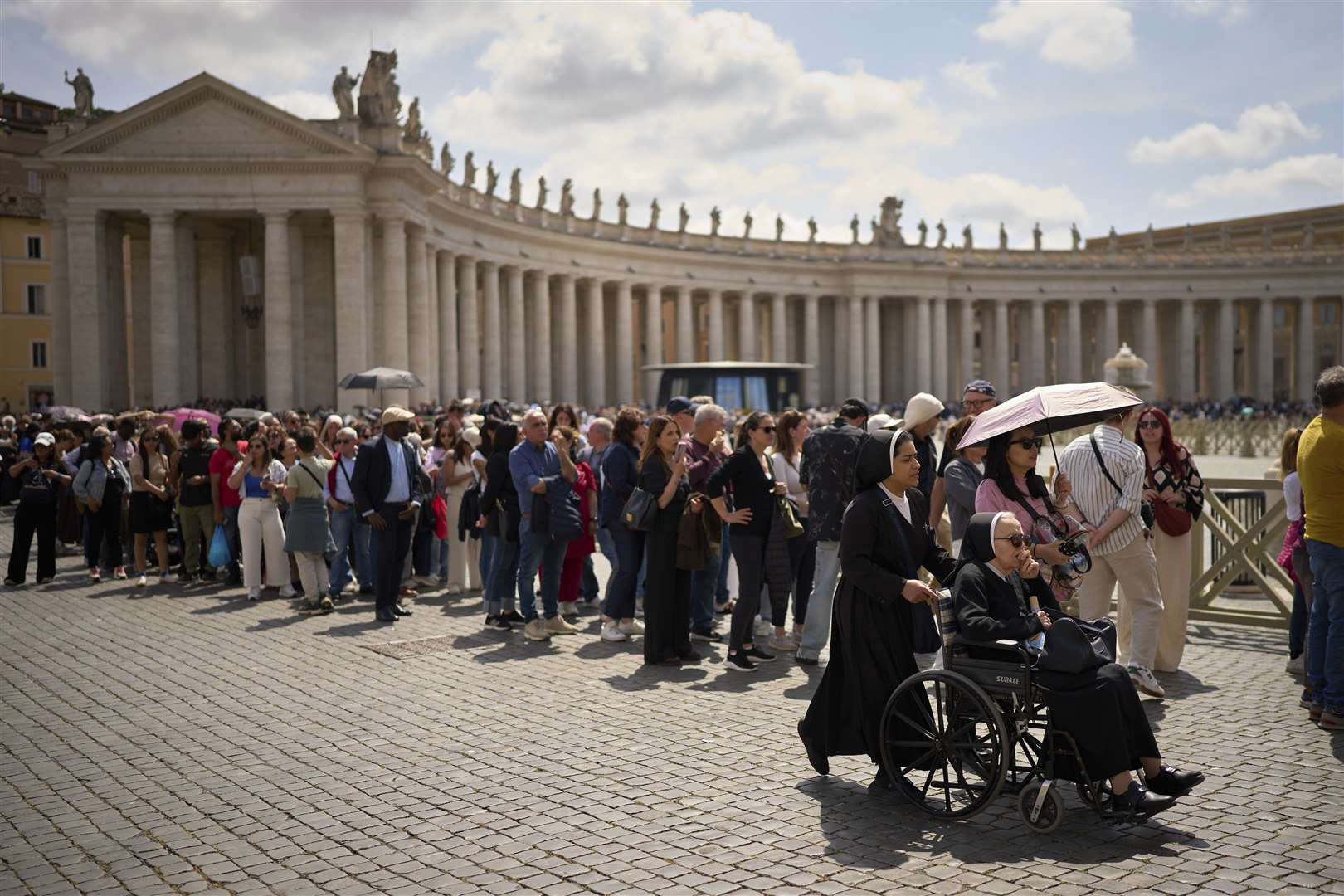 People stood in the sun for hours to pay their respects to the late Pope Francis (Emilio Morenatti/AP)
