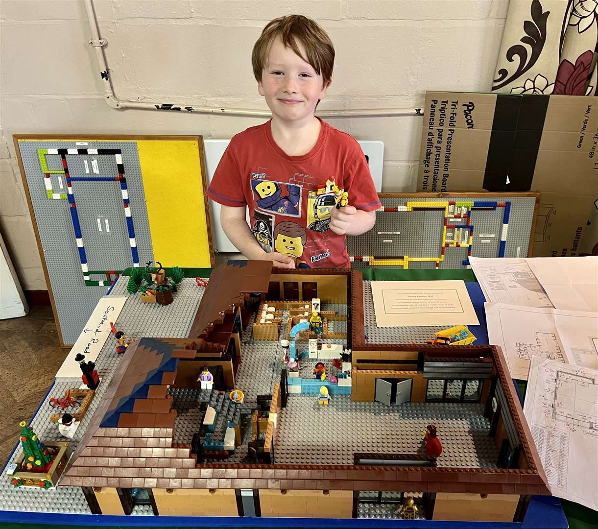 Caleb, 7, with his Lego model of the proposed new Bradfield Village Hall