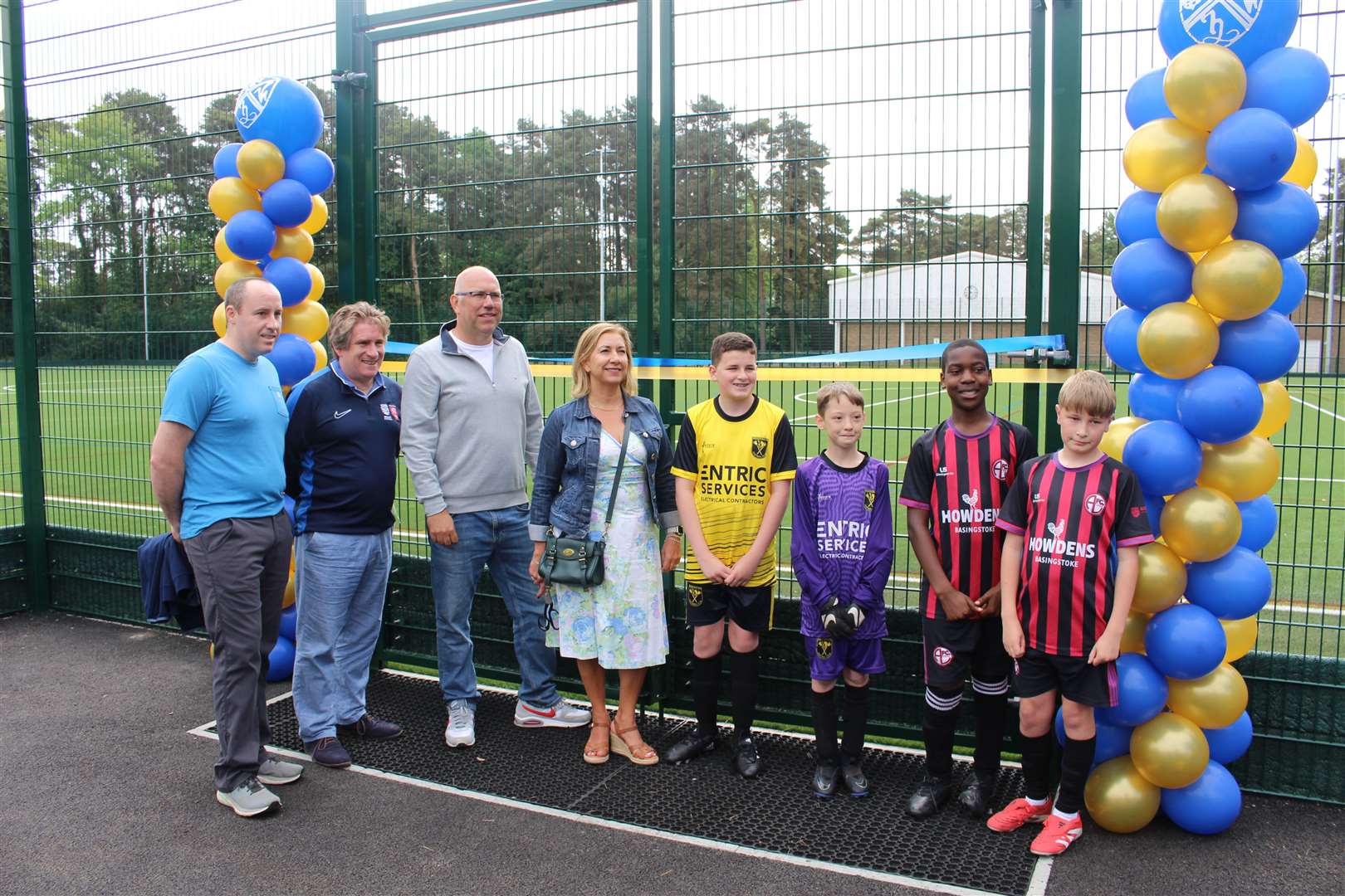 (From left to right) Local councillor Mr Morrow; Sacha Nicholas from the Hampshire FA; former headteacher of The Hurst School, Roger Jones; the school's current headteacher, Jayne McLaren; and players from Tadley Calleva FC and Aldermaston FC at the opening ceremony of the school's new 3G pitch