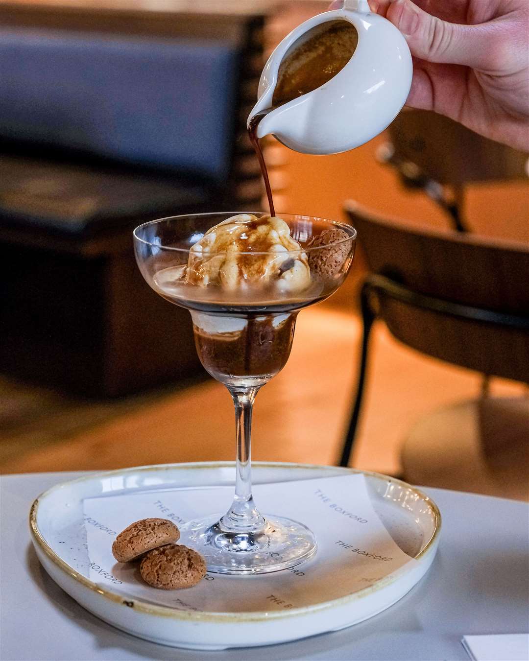 Affogato Cup Martini served with amaretti biscuits. Double espresso with a scoop of vanilla ice cream (£6)