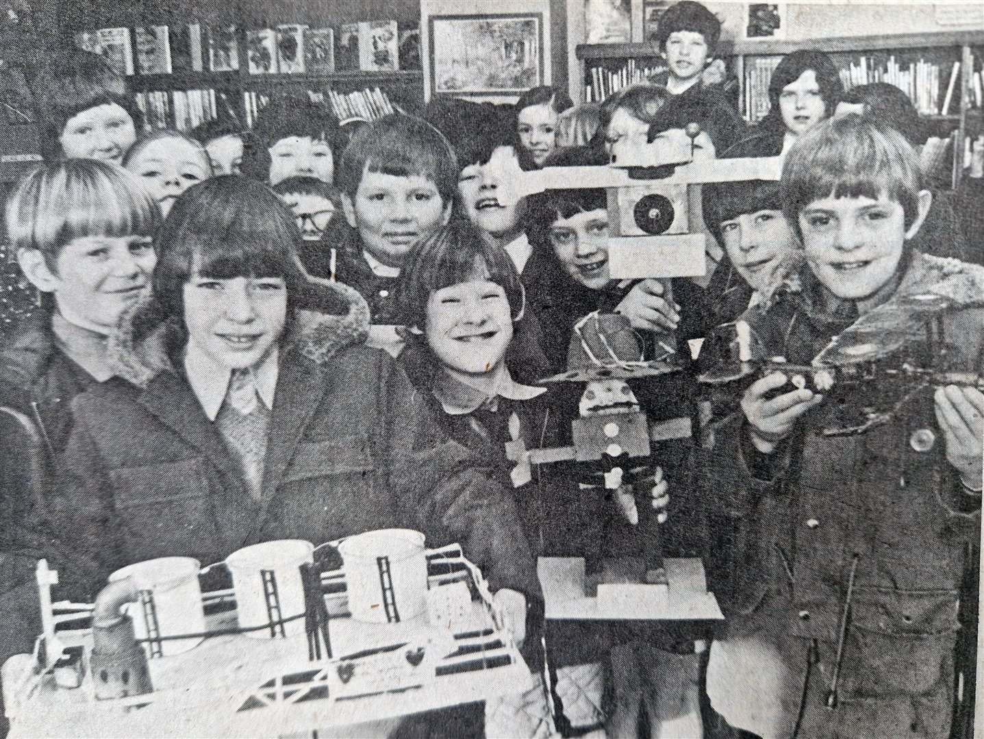 Children from Woolton Hill Primary School show off their creations in 1975. The pupils made models out of junk from the children’s library in 1975. Among the models were an aeroplane, what looks like a teasmade and a selection of figures