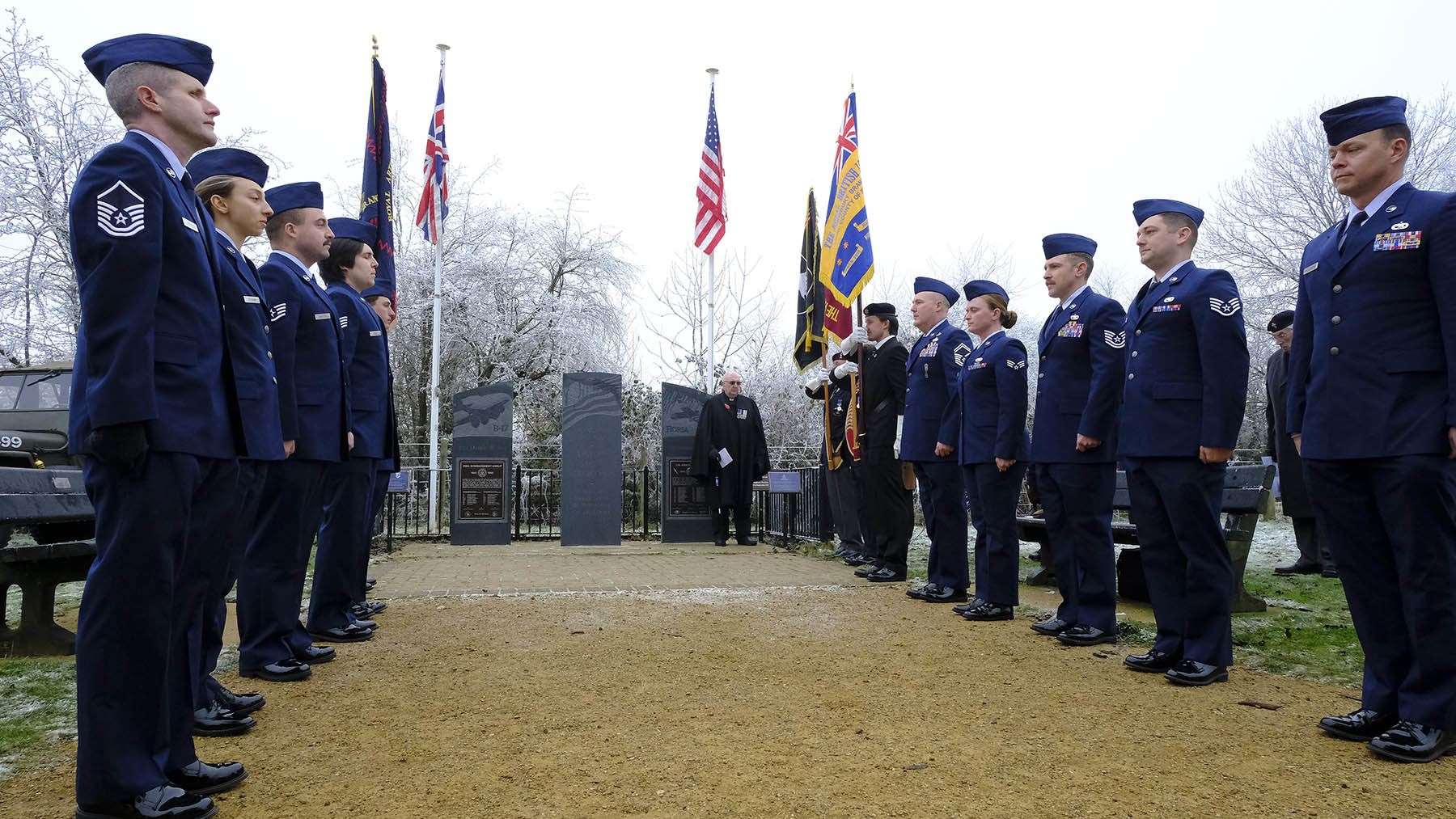 Honour guard stand in memory of the 49 American airmen killed in two aircraft accidents in 1944