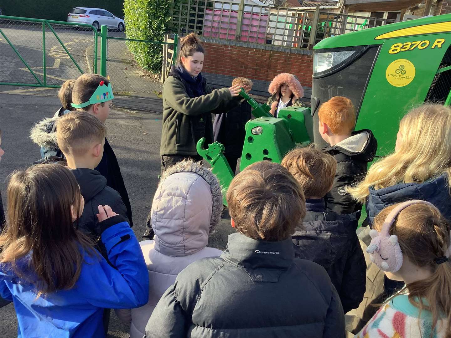 Eleanor showing pupils around her tractor