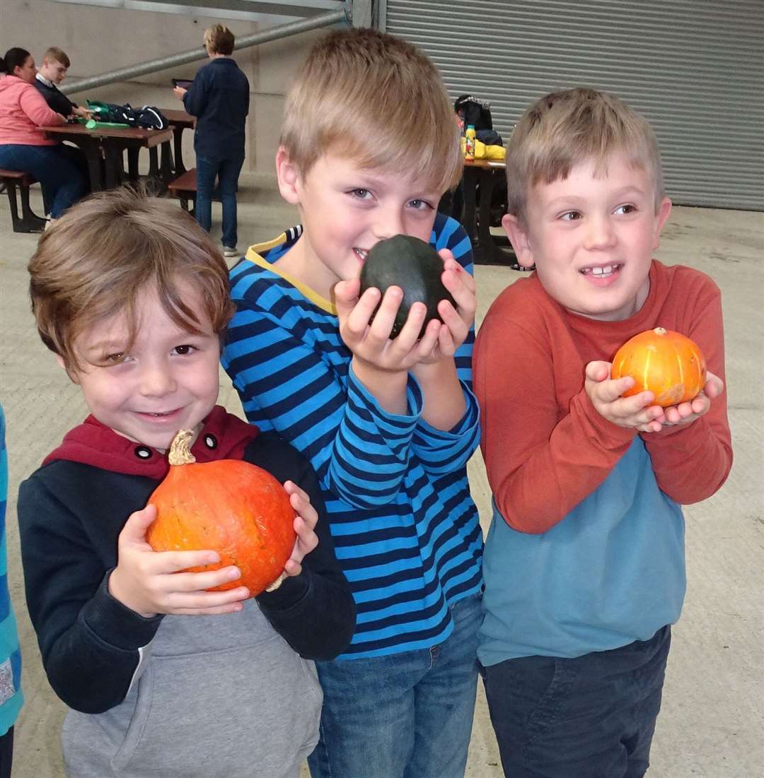 Newbury pupils showing off their squashes and pumpkins