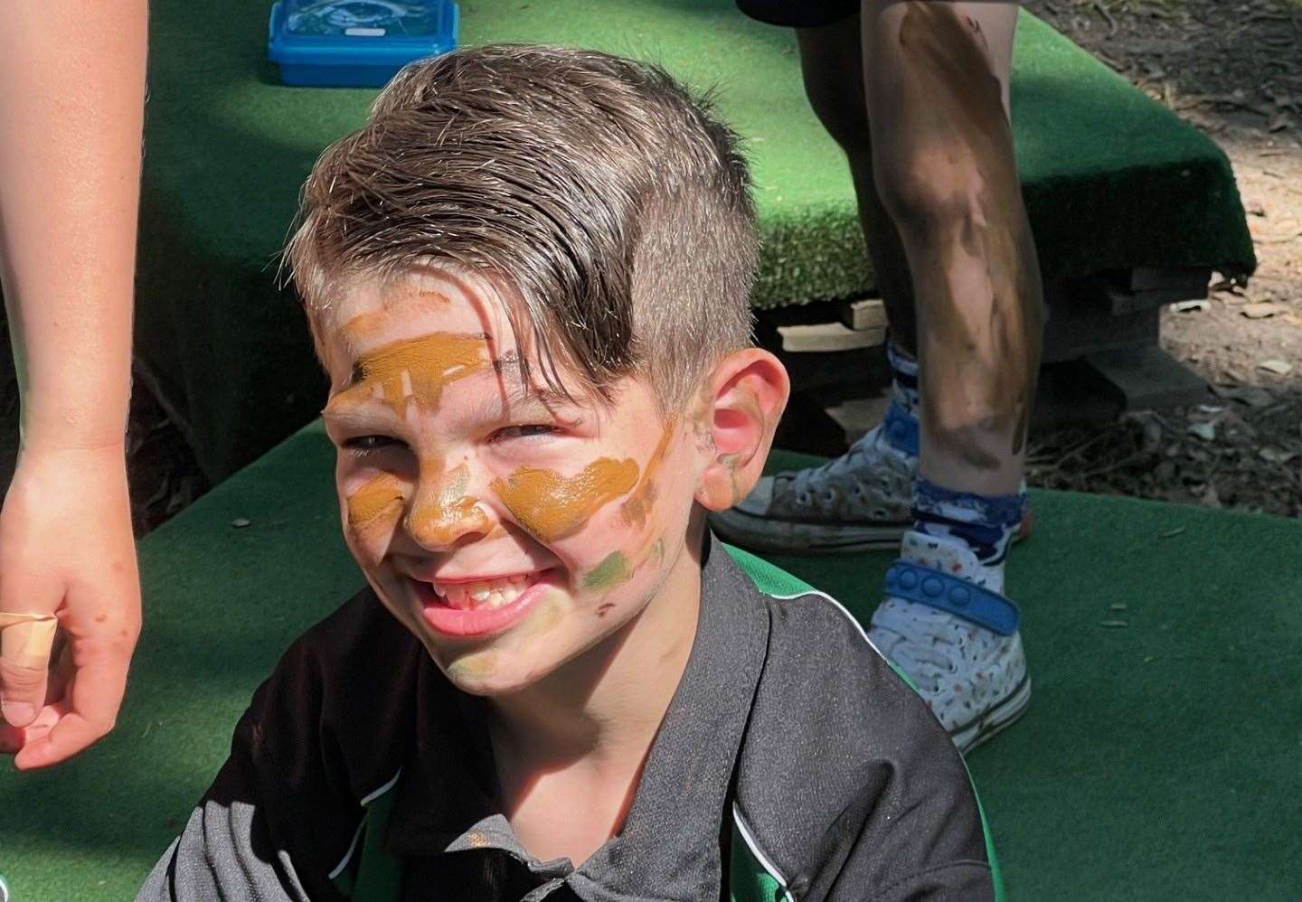 Year 4 pupil, Jacob, wearing camo paint as part of Armed Forces Day